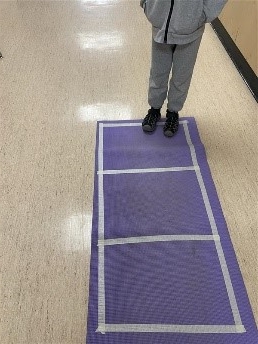 A person standing on a purple mat

AI-generated content may be incorrect., Picture