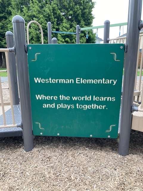 A sign on a playground
Description automatically generated